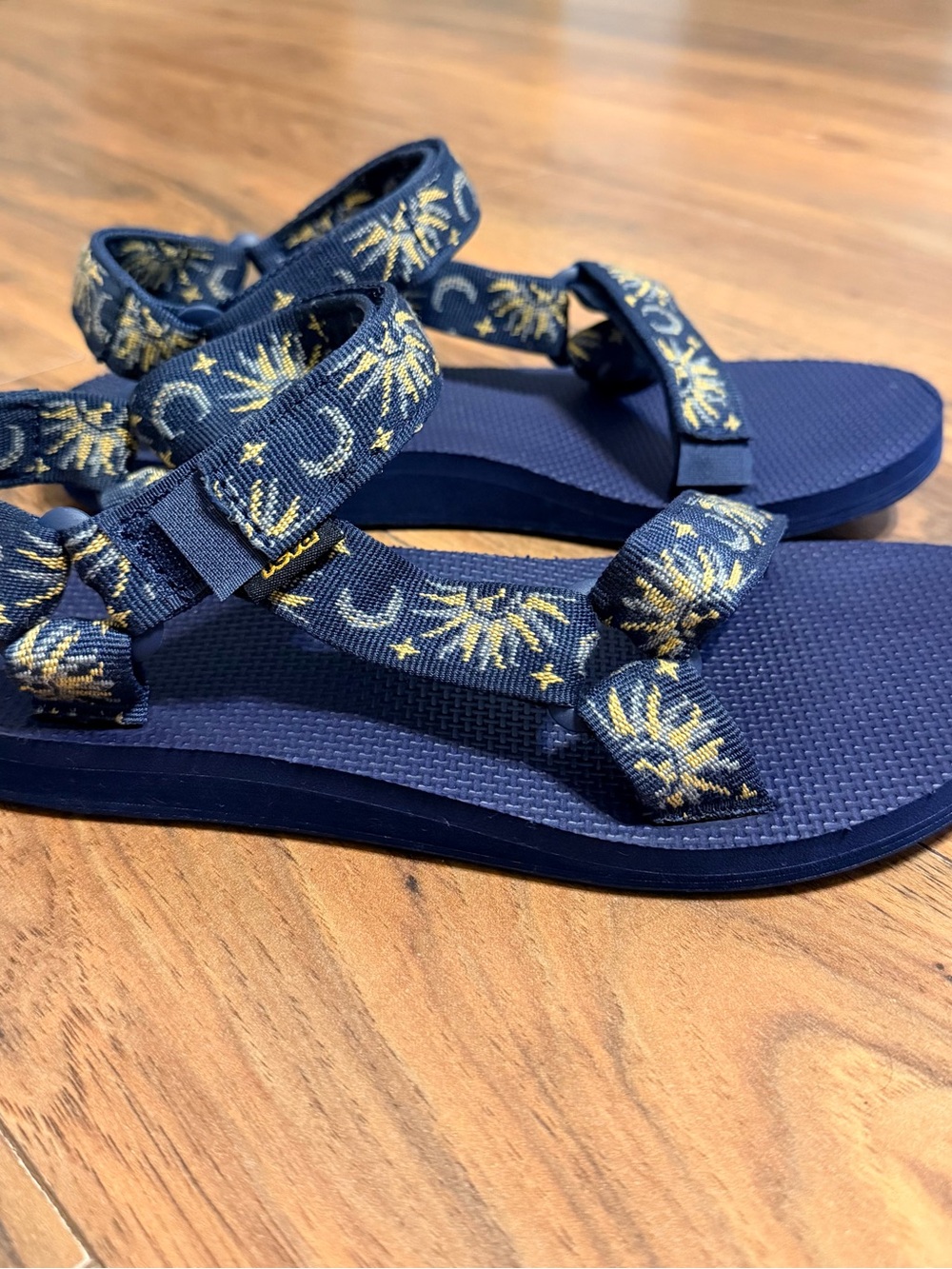 Teva Navy Blue Sandals with Gold Sun & Moon Pattern